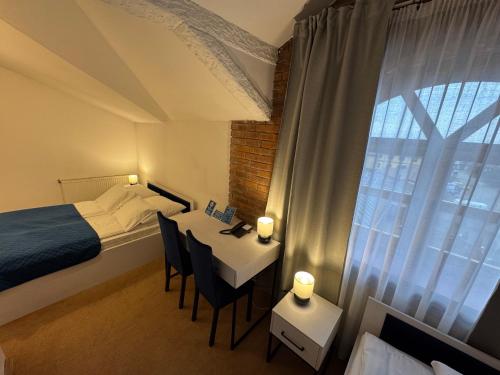 Posteľ alebo postele v izbe v ubytovaní Hotel Staropolska