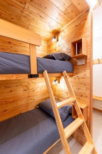 two bunk beds in a tiny house at Enjoy Alps - appartamenti vacanza in Sampeyre