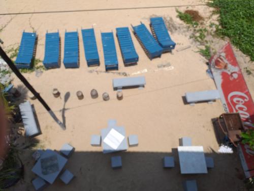 an overhead view of a beach with chairs and tables at Happy Tuna Beach Apartment in Hikkaduwa