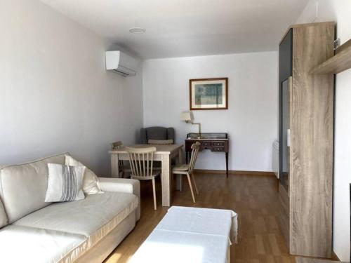 a living room with a couch and a table at Escapada perfecta La Conca del Barberà in Santa Coloma de Queralt