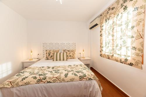 Postel nebo postele na pokoji v ubytování Casa de la Albolafia