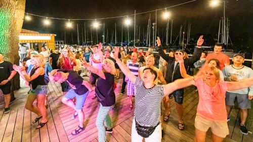 a group of people dancing on a dance floor at Stranda in Giżycko