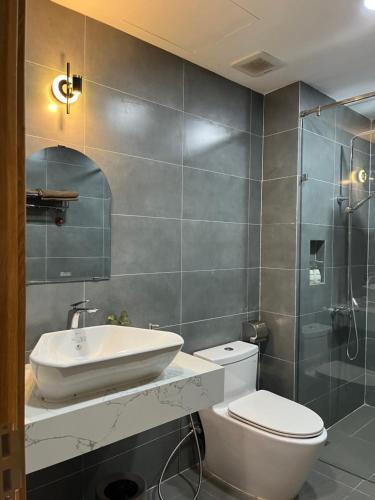 Koupelna v ubytování Triland Hotel