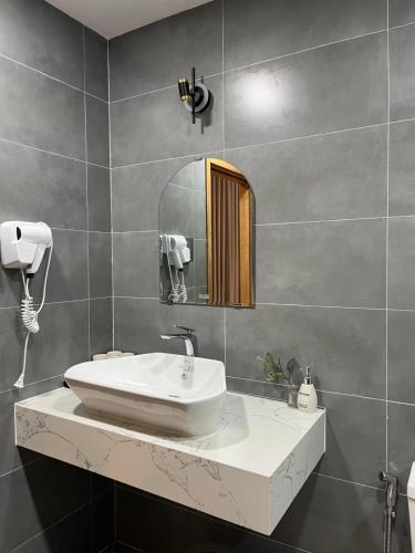 Koupelna v ubytování Triland Hotel