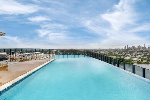 a large swimming pool on top of a building at Central 2BR-2BA Resort-Style Retreat In Hamilton M21 in Brisbane