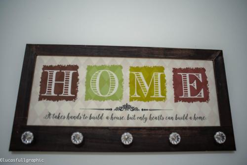 a framed picture of the word home with the words at Sophie's Choice in Rome