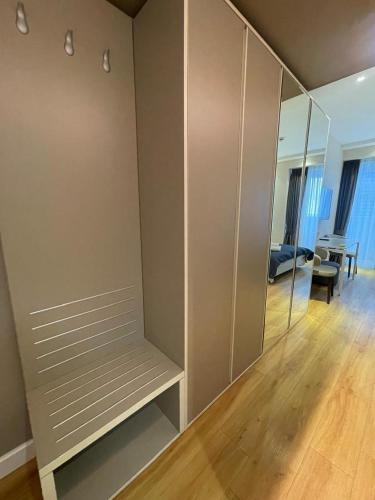 a room with a large closet with a mirror at Alliance palace 18 floor in Batumi