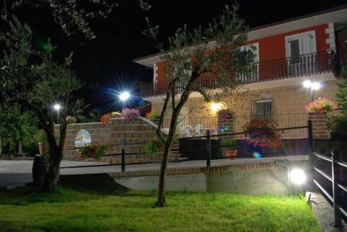a house with lights on the side of it at night at La Casa Sull'aia,AV in Santo Stefano del Sole