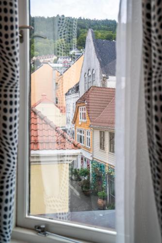 a view of a city from a window at Magic Hotel Korskirken in Bergen