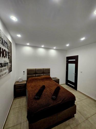 a bedroom with a large bed in a room at Platinum Court in Marsaskala