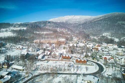 an aerial view of a town in the snow at Ośrodek Wczasowy PANORAMA Szczyrk in Szczyrk