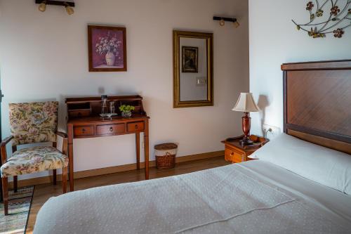 Postel nebo postele na pokoji v ubytování Hotel Rústico Fonteverde