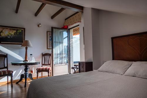 Postel nebo postele na pokoji v ubytování Hotel Rústico Fonteverde