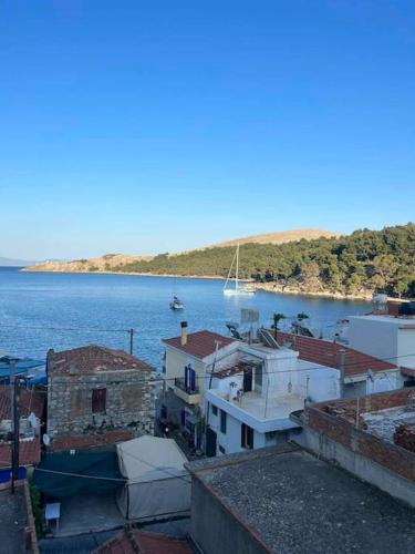 a view of a body of water with a boat in it at Lagkada Dream House in Chios