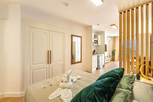 a living room with a dog laying on a couch at Luxury Studio 1 ocean view wifi free in Adeje