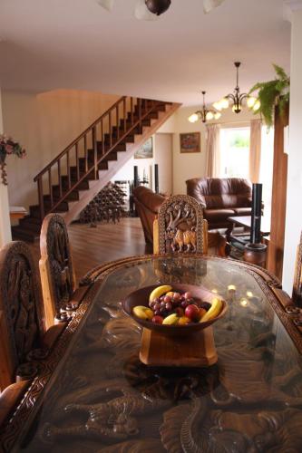 a bowl of fruit on a table in a living room at Blougans B&B in Gansbaai