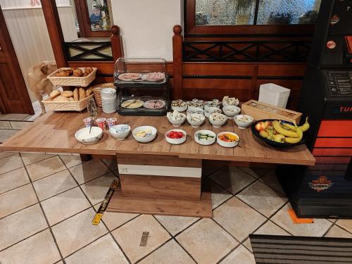 a table with a bunch of food on it at Hotel-Bad Goisern in Bad Goisern