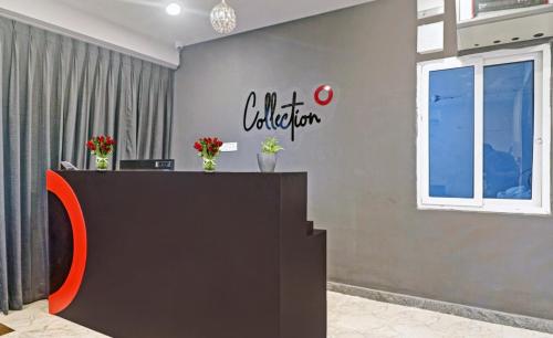 an office with a reception desk with a sign on the wall at Super Townhouse RCC Pristine in Hyderabad