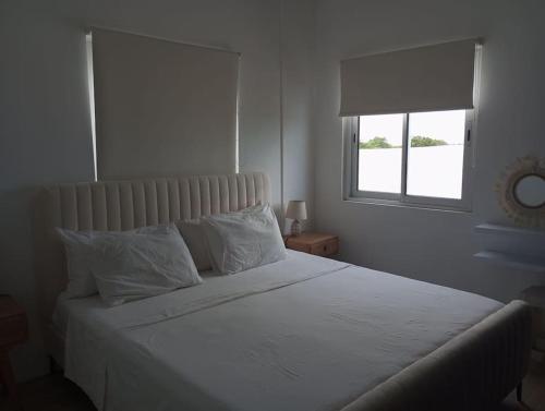 Ένα ή περισσότερα κρεβάτια σε δωμάτιο στο Cosy house with pool