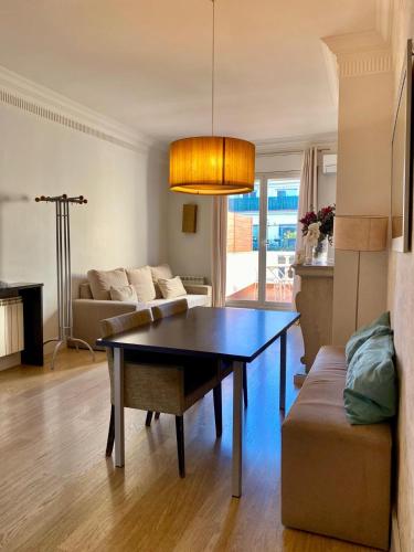 a living room with a table and a couch at Hostal Goya in Barcelona