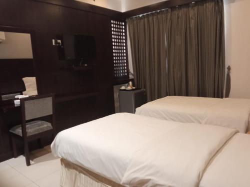 Asfar Hotel Apartmentsにあるベッド