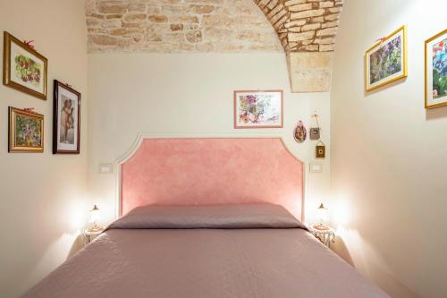 Ένα ή περισσότερα κρεβάτια σε δωμάτιο στο A Casa di Marilù by Rentbeat