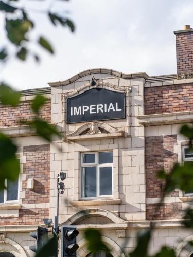 a sign on the side of a building at Imperial Salford Hotel in Manchester
