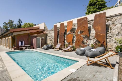 a villa with a swimming pool and a building at Beco do Paço by Porto Dream Stays in Porto