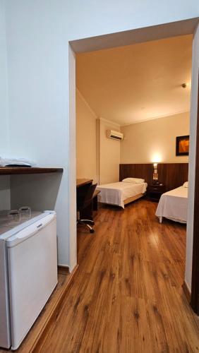 Postel nebo postele na pokoji v ubytování Firenze Hotel Votuporanga