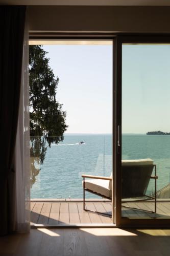 a view of the ocean from a room with a window at Grand Hotel Fasano in Gardone Riviera