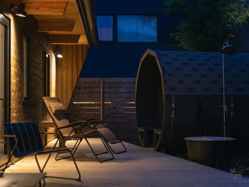 a couple of chairs sitting on a patio at 山郷 Villas in Nature in Otaru