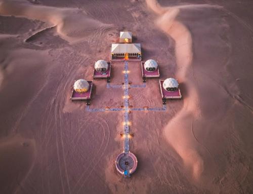 an aerial view of a boat in the water at Royal Sahara Dome Camp in Merzouga