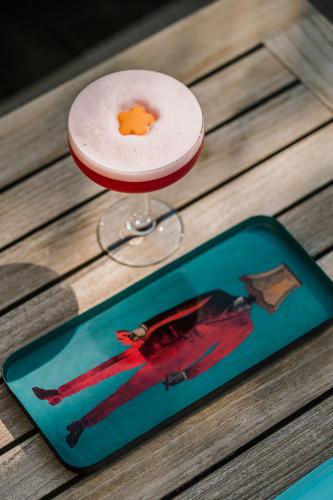 a drink sitting on top of a table at Grand Hotel Fasano in Gardone Riviera