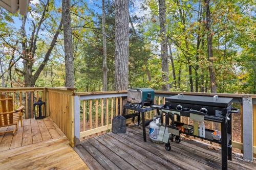 a bbq on a wooden deck with a grill at ClemsonILakesideIParkPassIPizzaOvenlYouTubeTVlFirePit in Anderson