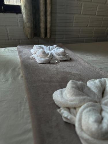 Una cama o camas en una habitación de Muretá Pousada