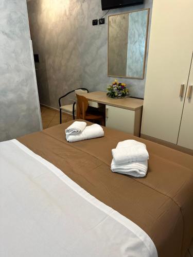 Ein Bett oder Betten in einem Zimmer der Unterkunft Scilla e Cariddi