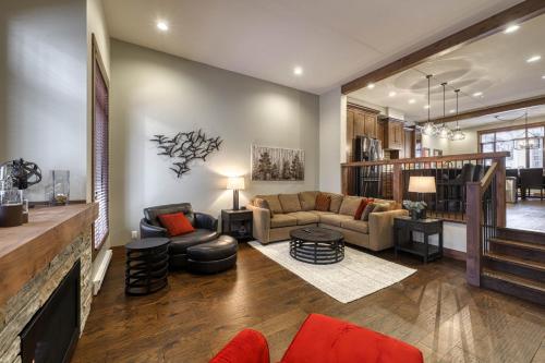 a living room with a couch and a table at 17 Village Walk Sun Peaks BC in Sun Peaks