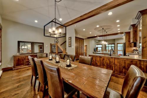 a dining room with a wooden table and chairs at 17 Village Walk Sun Peaks BC in Sun Peaks