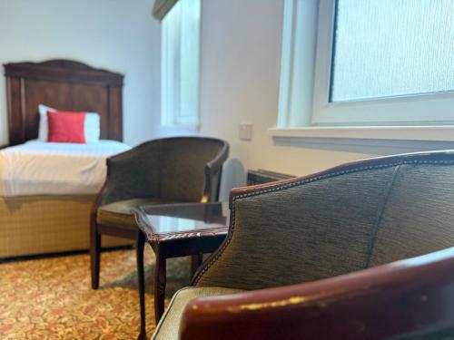 Ένα ή περισσότερα κρεβάτια σε δωμάτιο στο Aberdeen Douglas Hotel