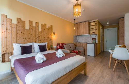 a bedroom with a large bed in a room at New Gudauri Ski4Life in Gudauri