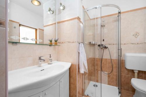 a bathroom with a sink and a shower at House Bruna in Kršan