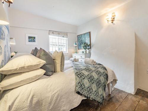 a bedroom with a bed and a chair at Uk44005 - Carters Yard in Kimbolton