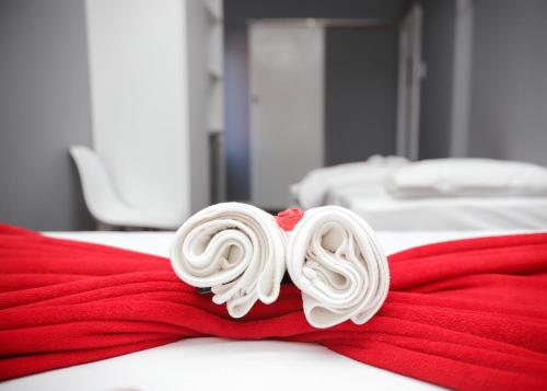 a pile of white lollipops on a red towel at Kingsworth inn Port Elizabeth in Port Elizabeth