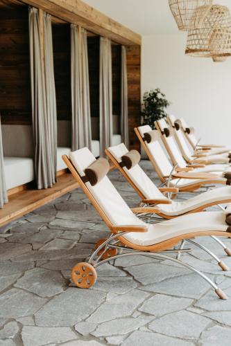 a row of chairs sitting in a room at Löckerwirt in Sankt Margarethen im Lungau