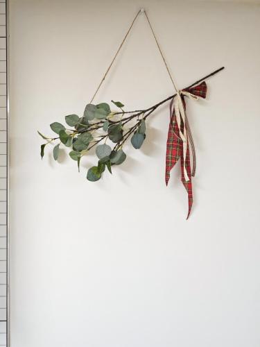 a christmas ivy ornament hanging on a wall at Sillim Queen House in Seoul