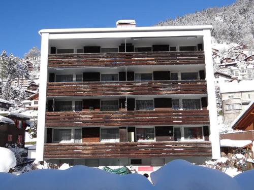 an apartment building with snow on the ground at Apartment Alte Gasse 9 Wohnung 3- Stock by Interhome in Engelberg