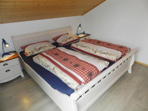 a bedroom with two beds and a table with two lamps at Apartment Panorama- Chalet by Interhome in Blankenburg