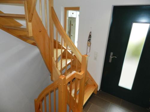 a wooden staircase in a room with a door at Apartment Panorama- Chalet by Interhome in Blankenburg