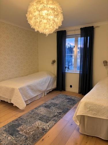 Katil atau katil-katil dalam bilik di Hagneryd Gård B&B