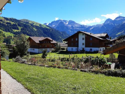 a view of a village with mountains in the background at Apartment Stöckli Studio by Interhome in Lenk